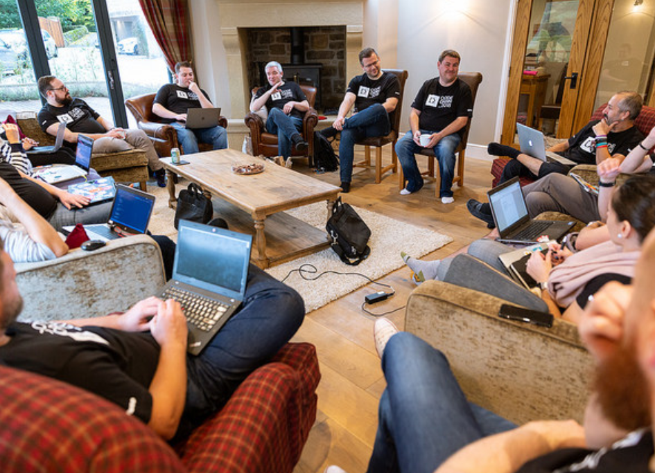 CODECABIN attendees sitting in a circle in the lounge